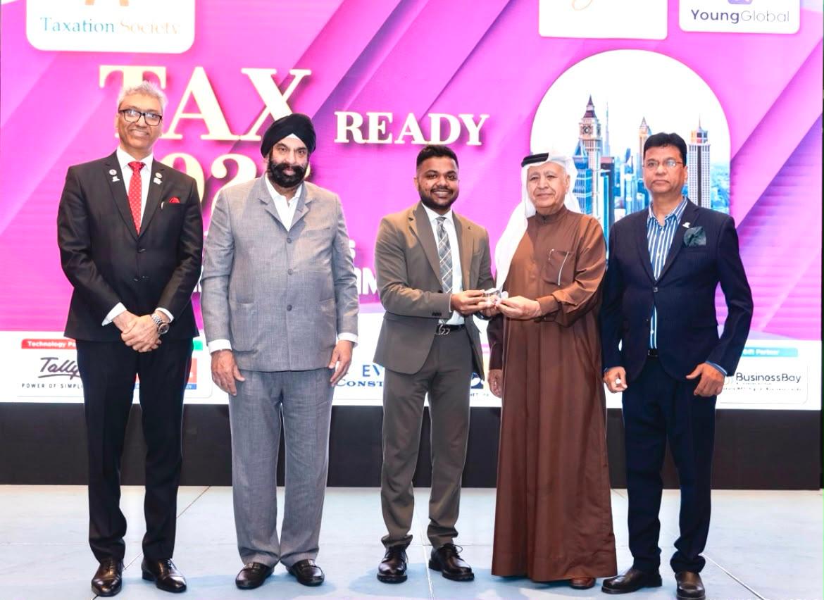 Ekansh Agrawal receiving recognition at the Tax Ready 2025 event by Taxation Society